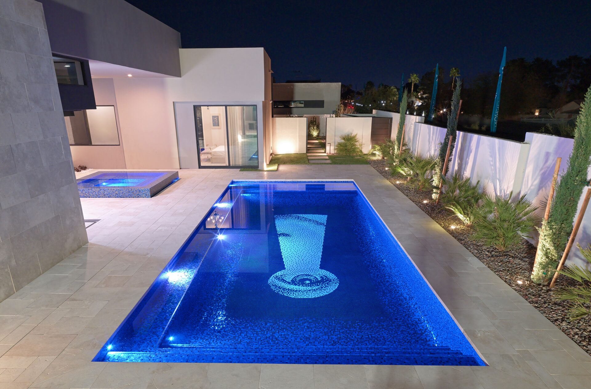 Modern minimalist pool with custom Fornasetti mosaic
