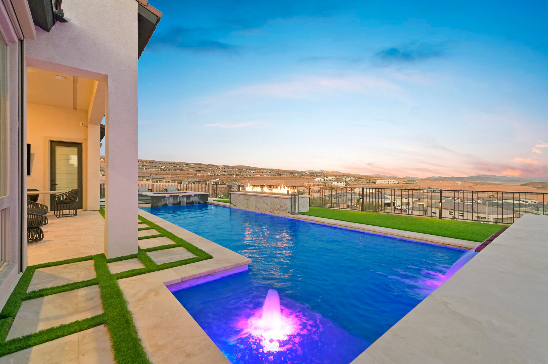 Linear pool with raised fire and water spa overlooking Lake Las Vegas