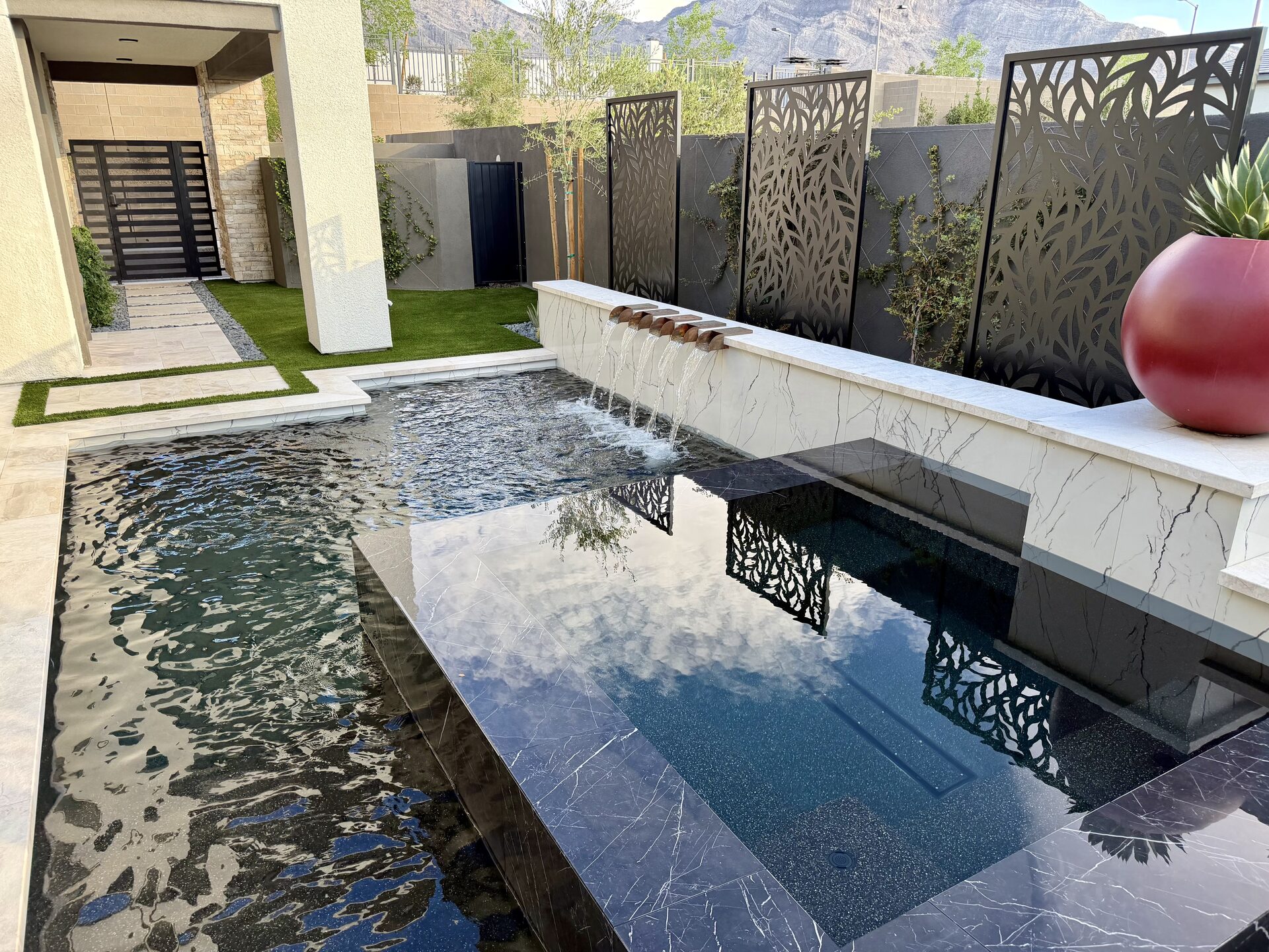 Architectural black reflecting pool with mountain backdrop